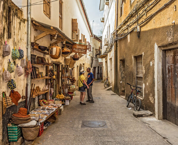 stone town_tourists-on-a-typical-narrow-street-in-stone-town-zanzibar-e1713023620250